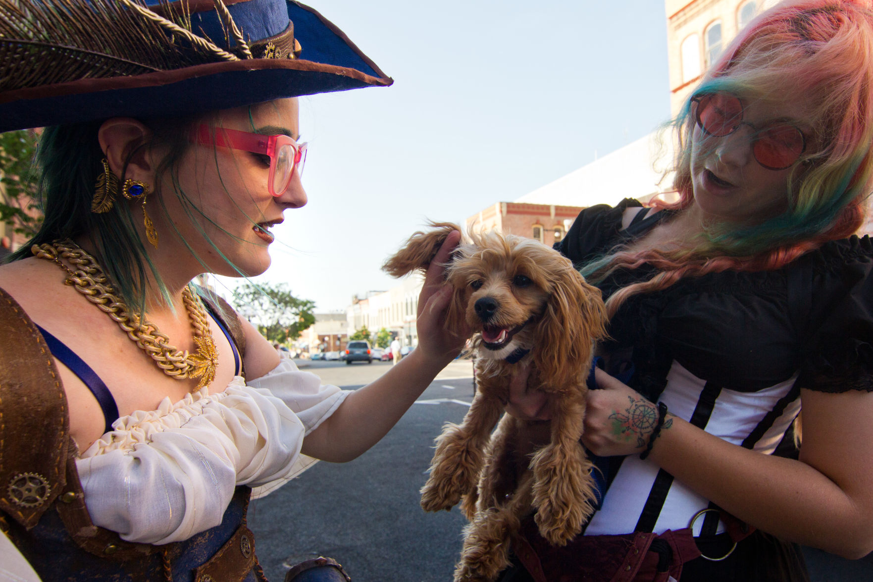 Courtney Toon, left, petting Coventry, held by Blaine Kemp